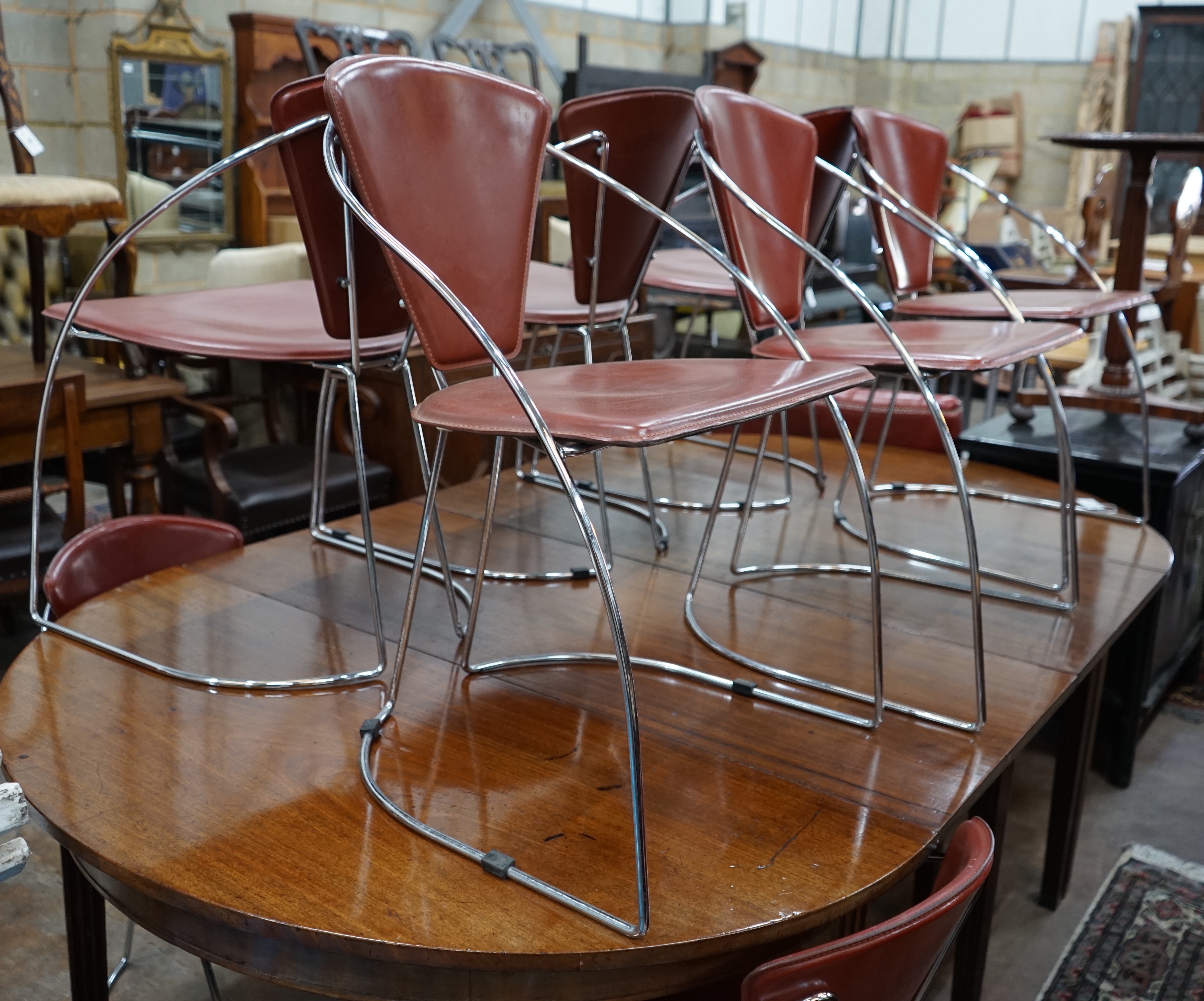 A set of eight contemporary Italian leather and chrome dining chairs, width 52cm depth 55cm height 78cm